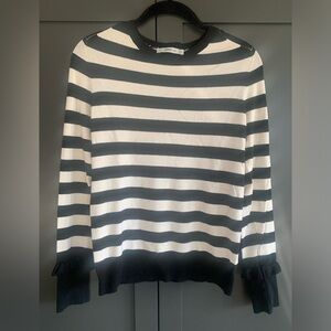 Zara sweater knit top.  Black and white stripes.Pearl and ruffle detail at wrist